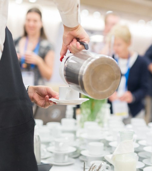 Coffee being poured into coffee cup