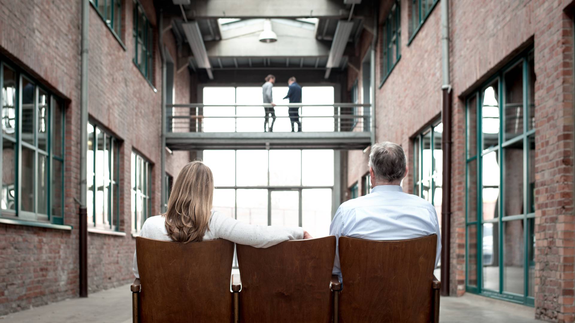 Two stodt employees sitting with their backs to the camera