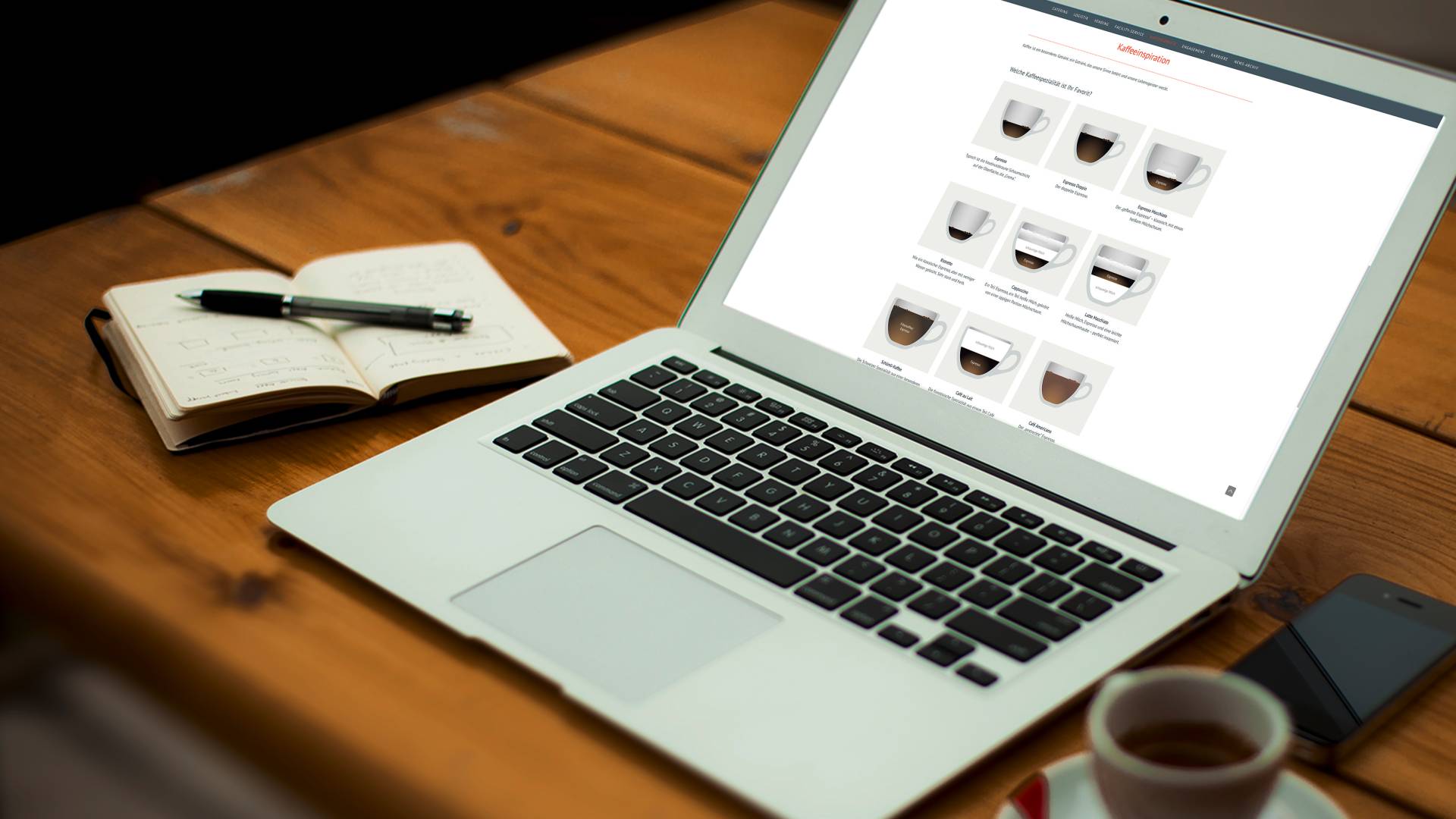 Laptop on a table with coffee specialities on the screen