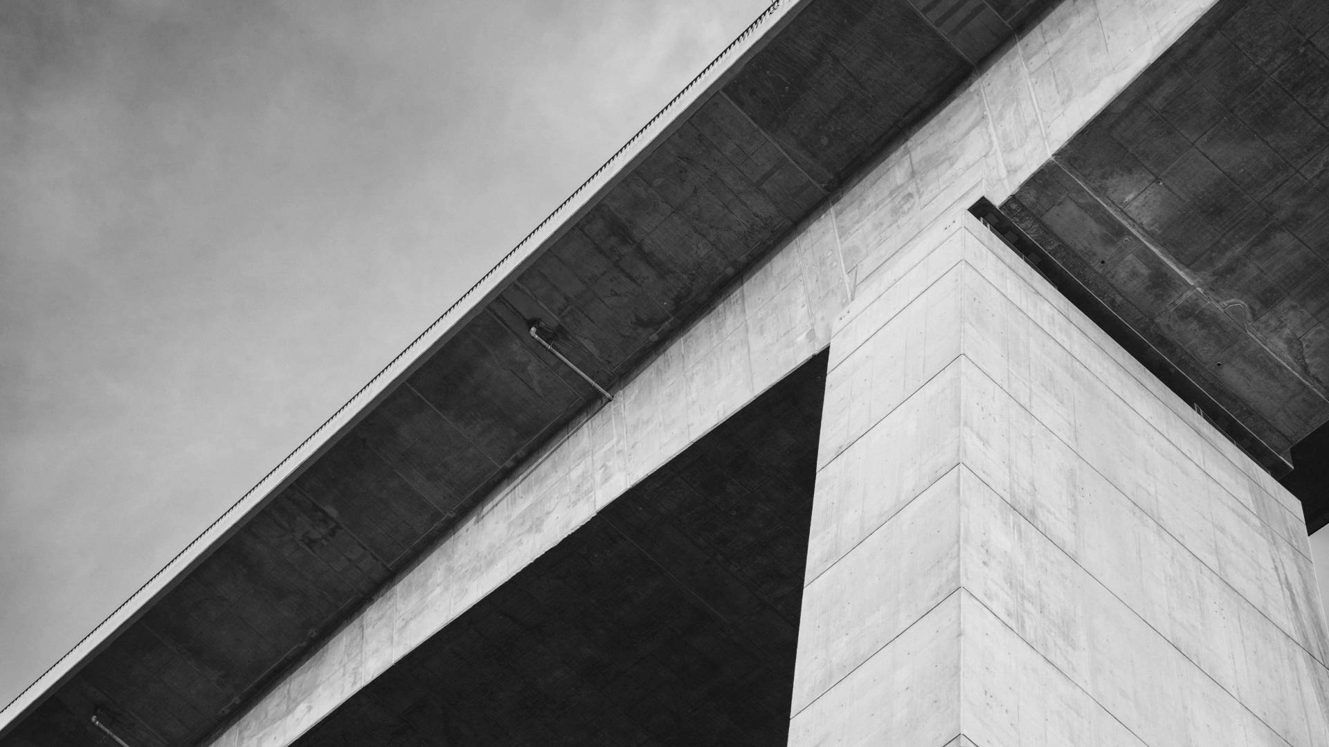Black and white shot of a concrete bridge