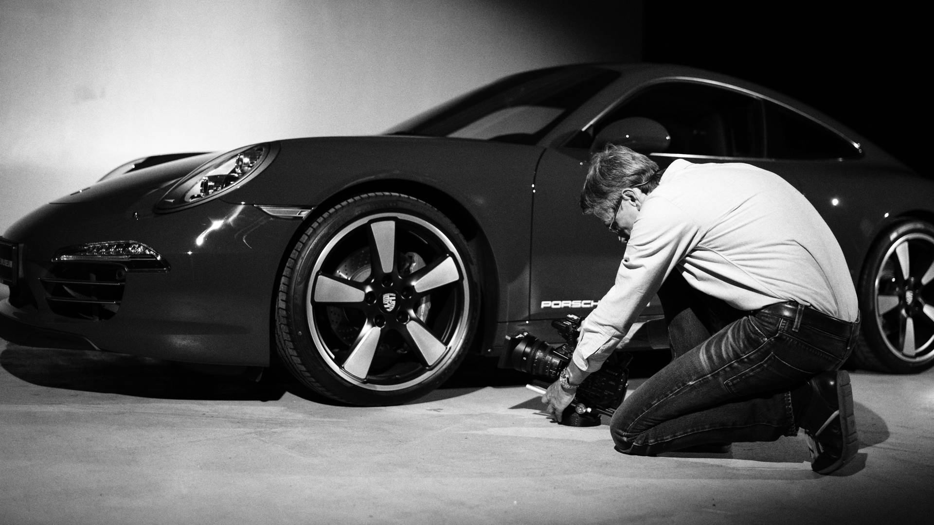 Black and white shot of the Porsche with the cameraman
