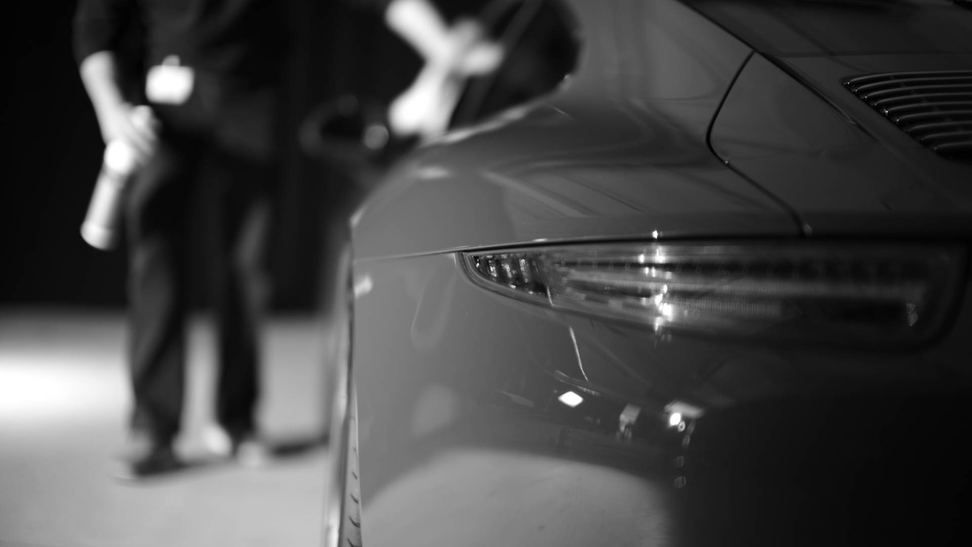 Black and white close-up of a Porsche