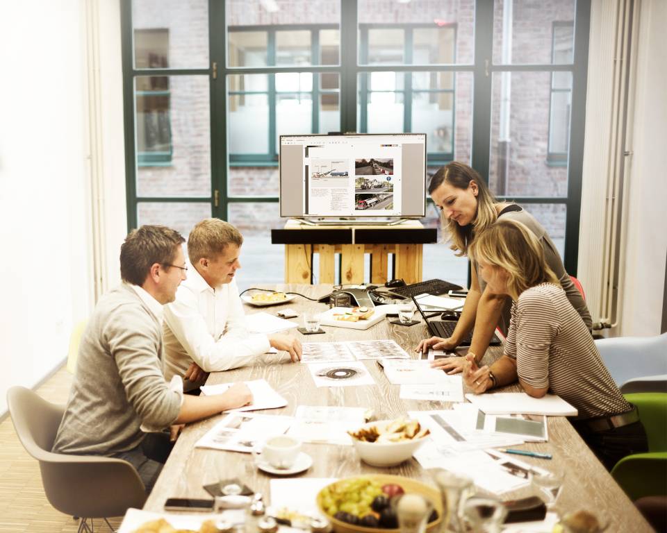 WIRTGEN and stodt employees at a table during a meeting